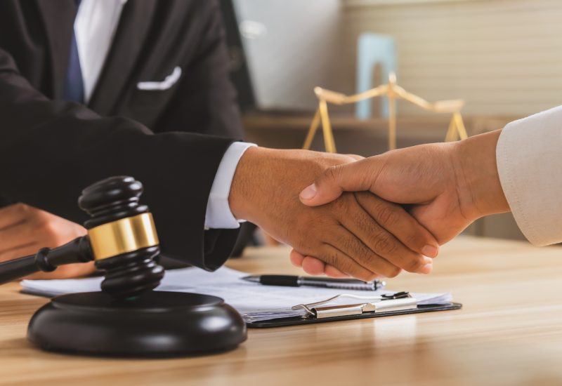 justice-and-law-concept-legal-law-advice-and-justice-businessman-handshake-with-a-lawyer-